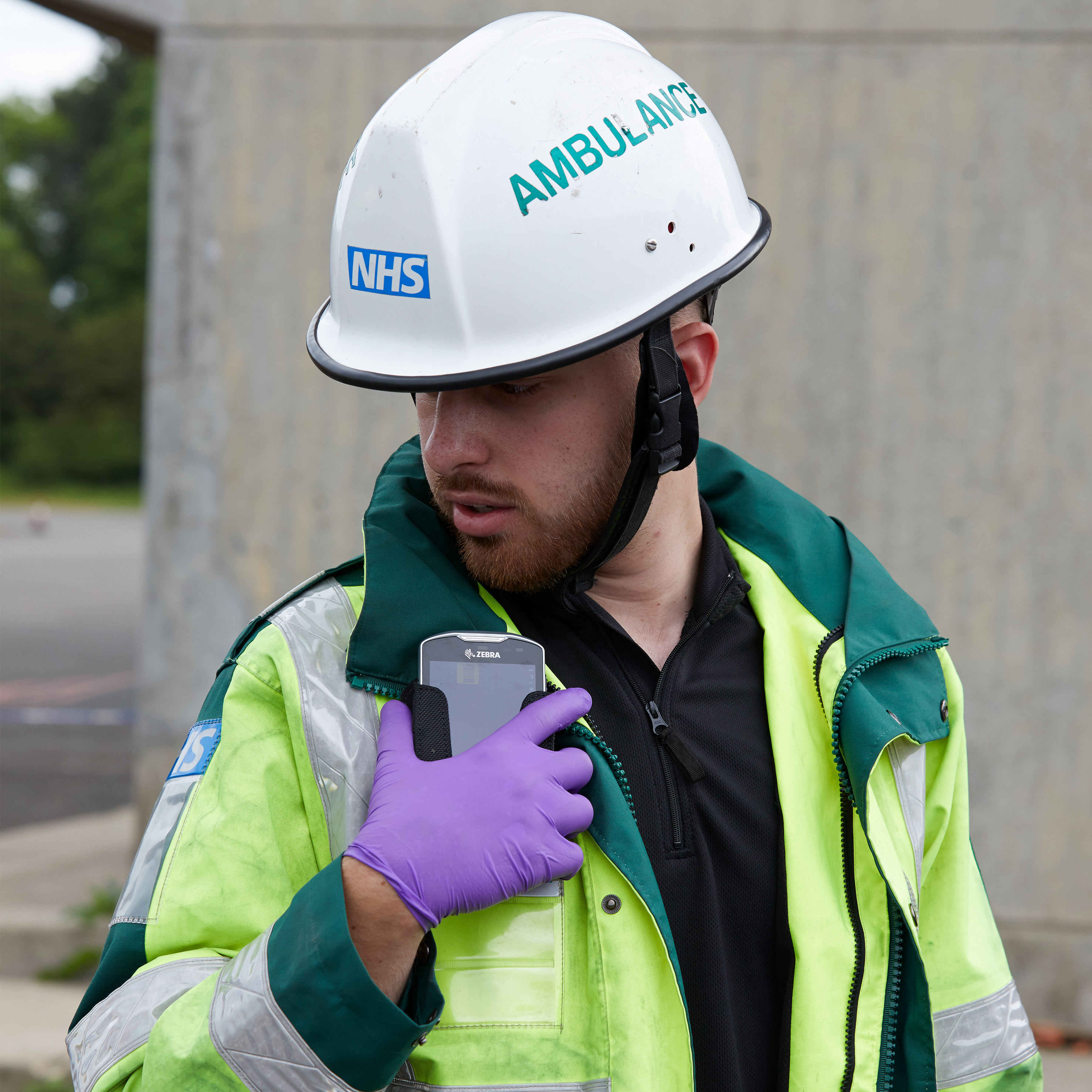 public sector photography website paramedic side talking handheld