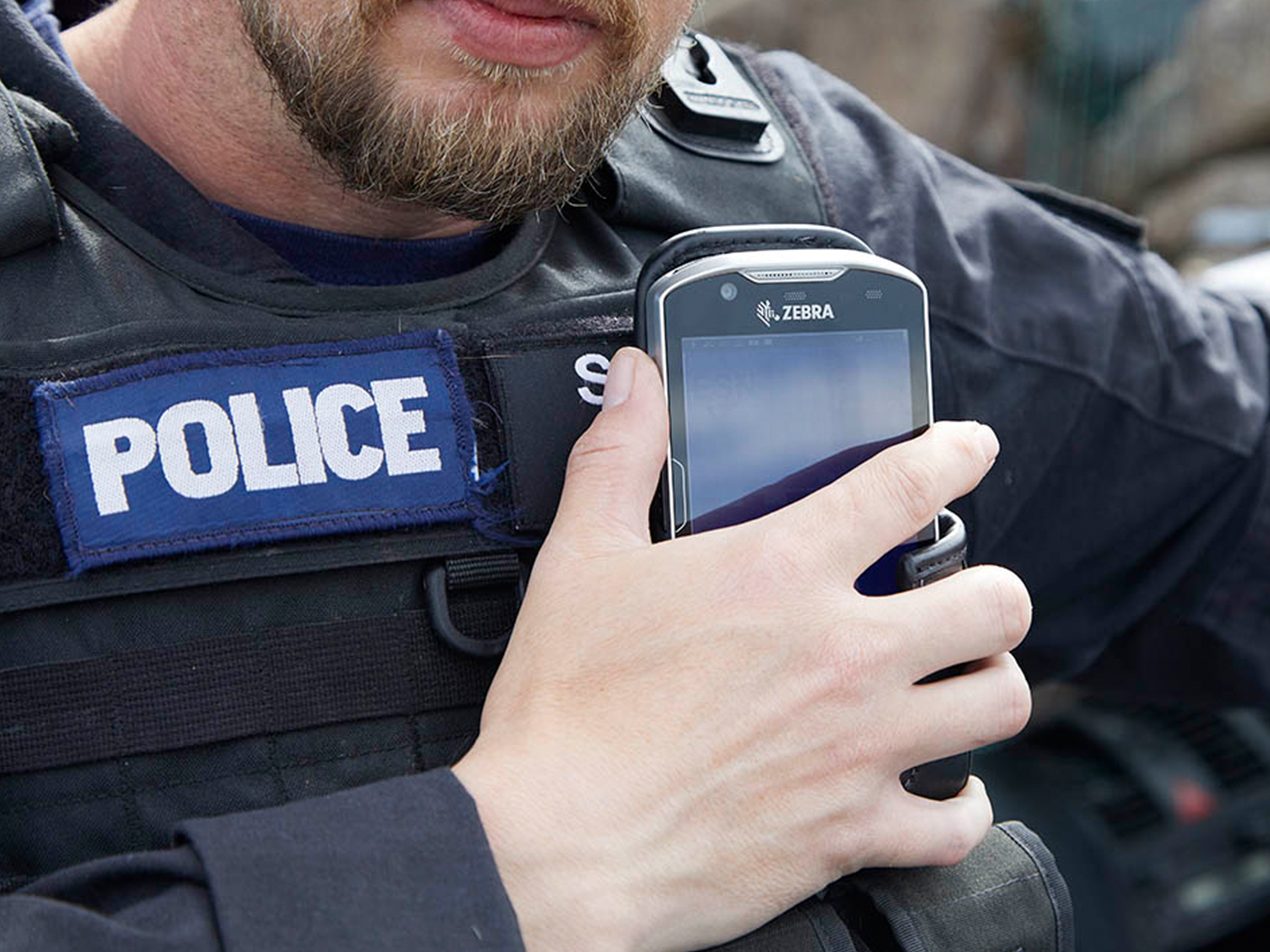 public sector photography website police officer handheld in hand talking close up