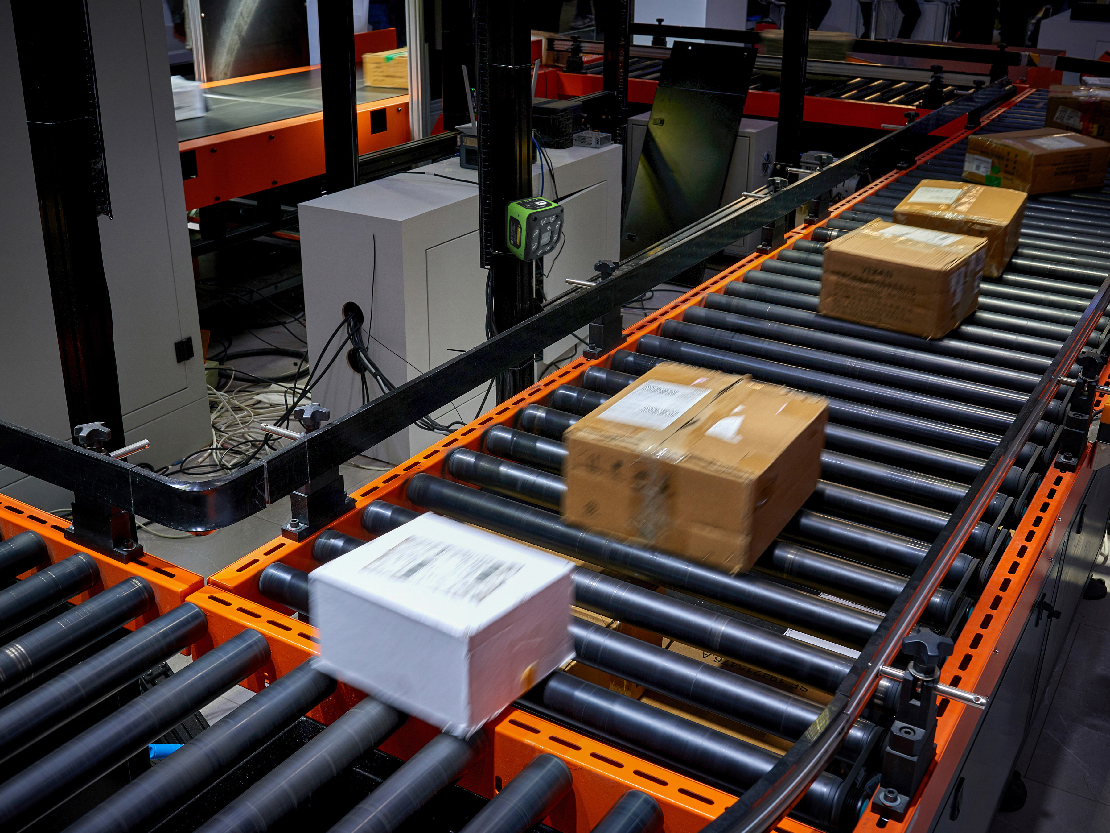 Parcels being sorted at the warehouse by a Zebra fixed scanner 