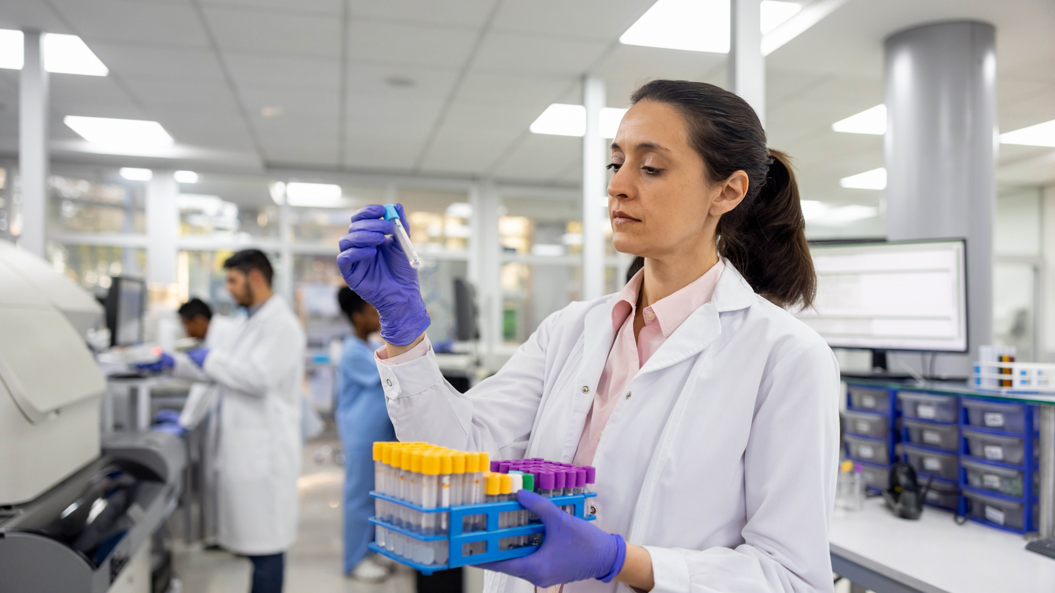 A scientist examining some samples in the laboratory.
