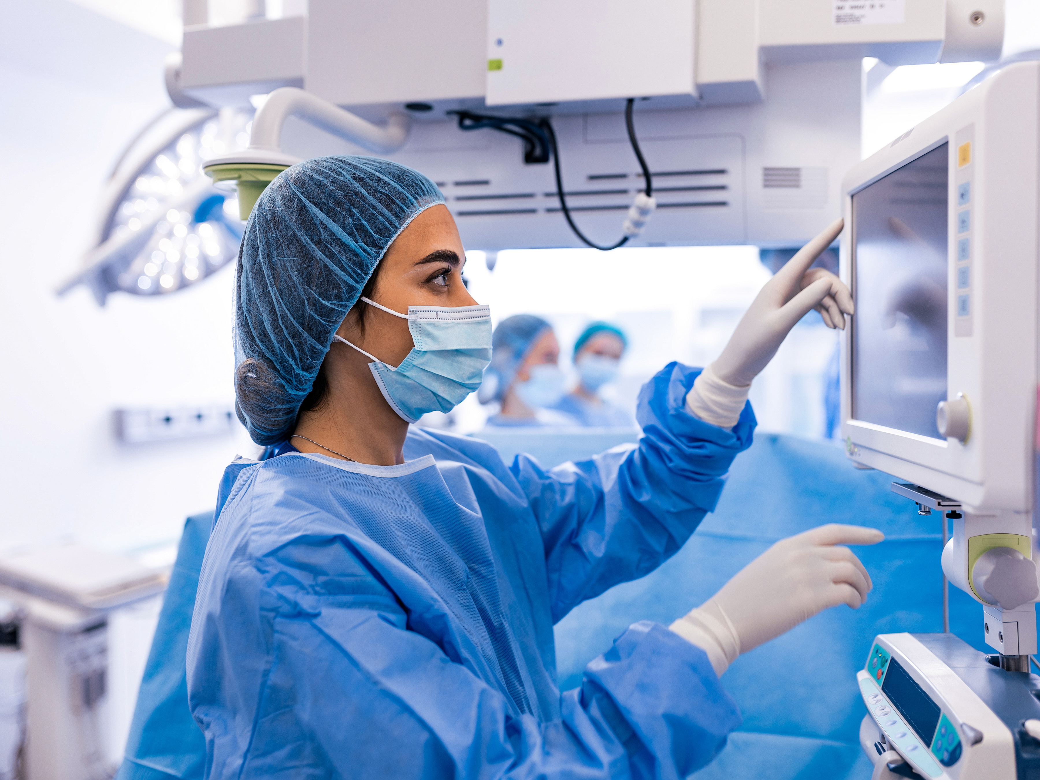 Surgical worker in an operating room.