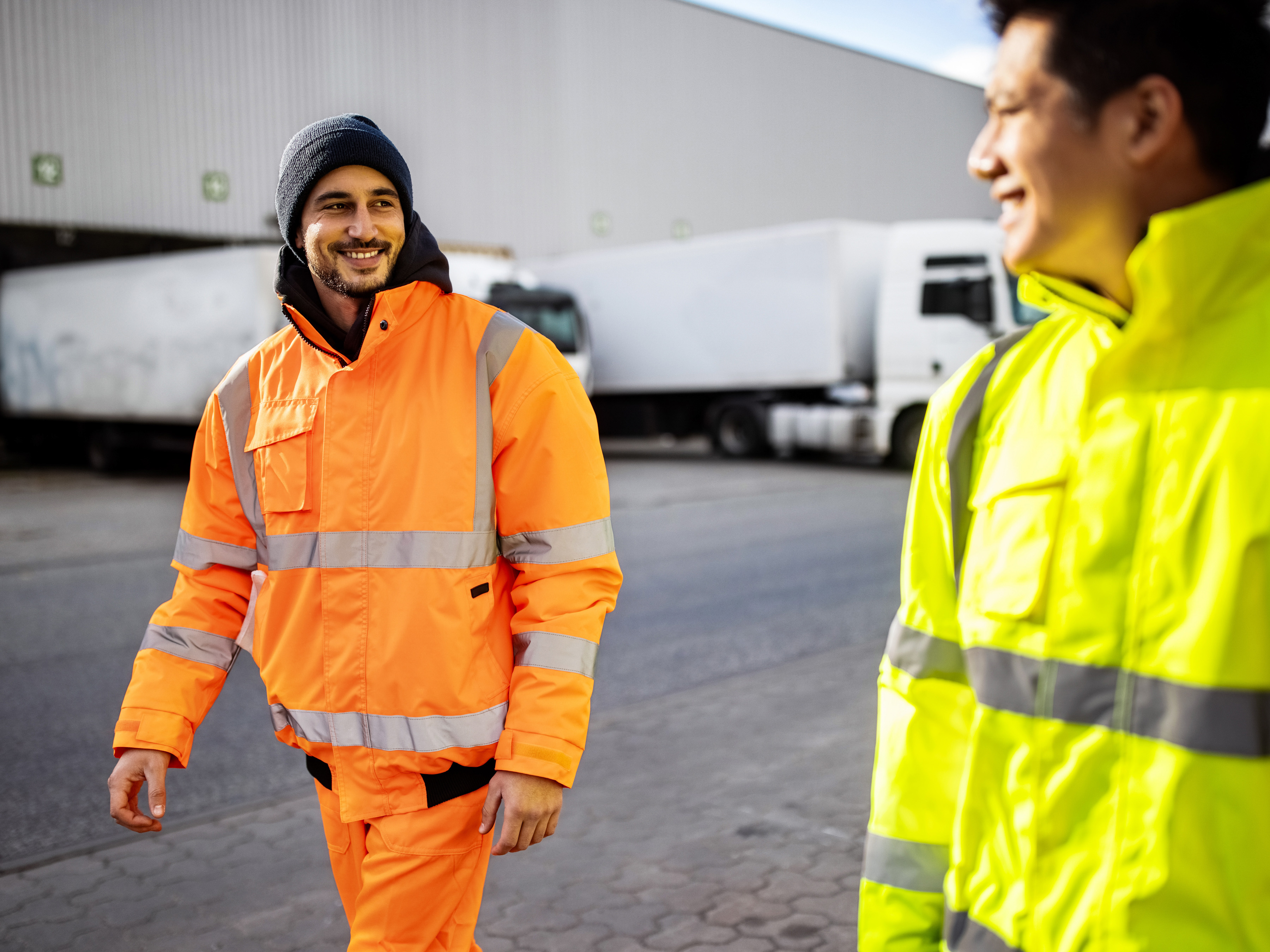 Workers walking outside a transport center.