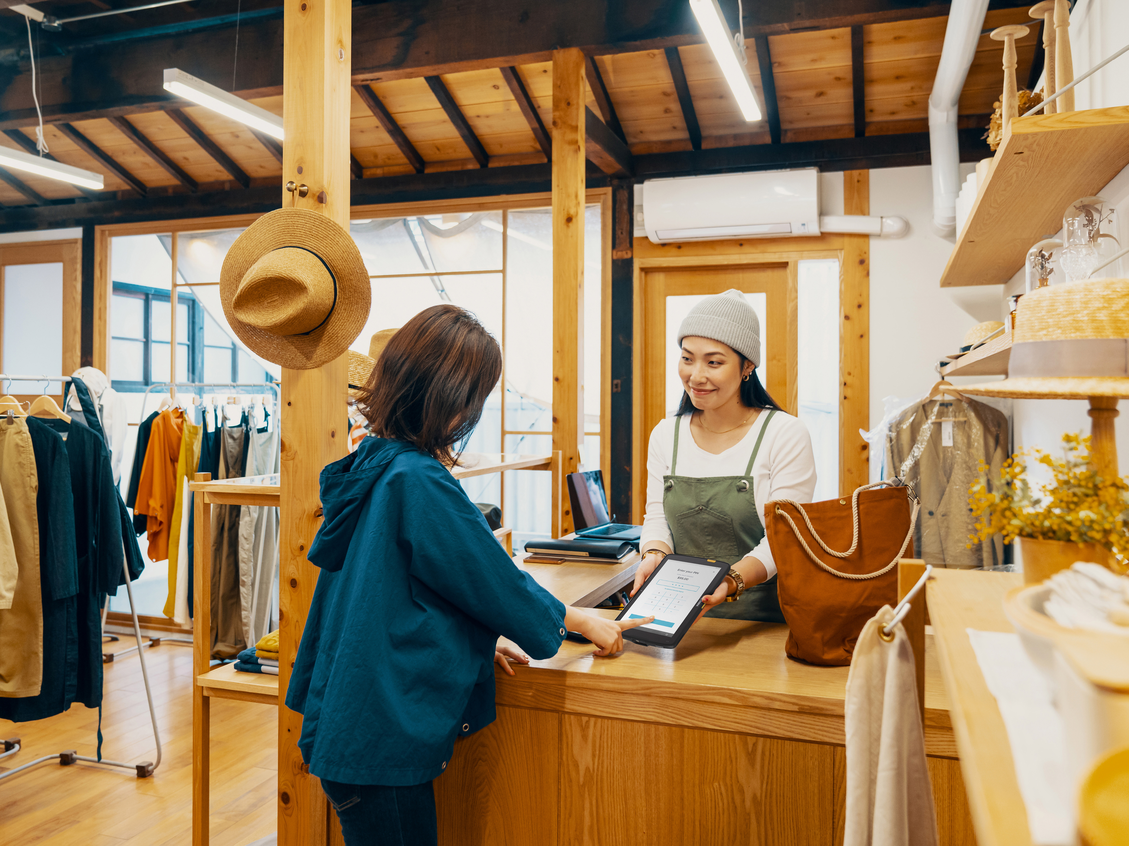 Worker with customer in a grocery store aisle