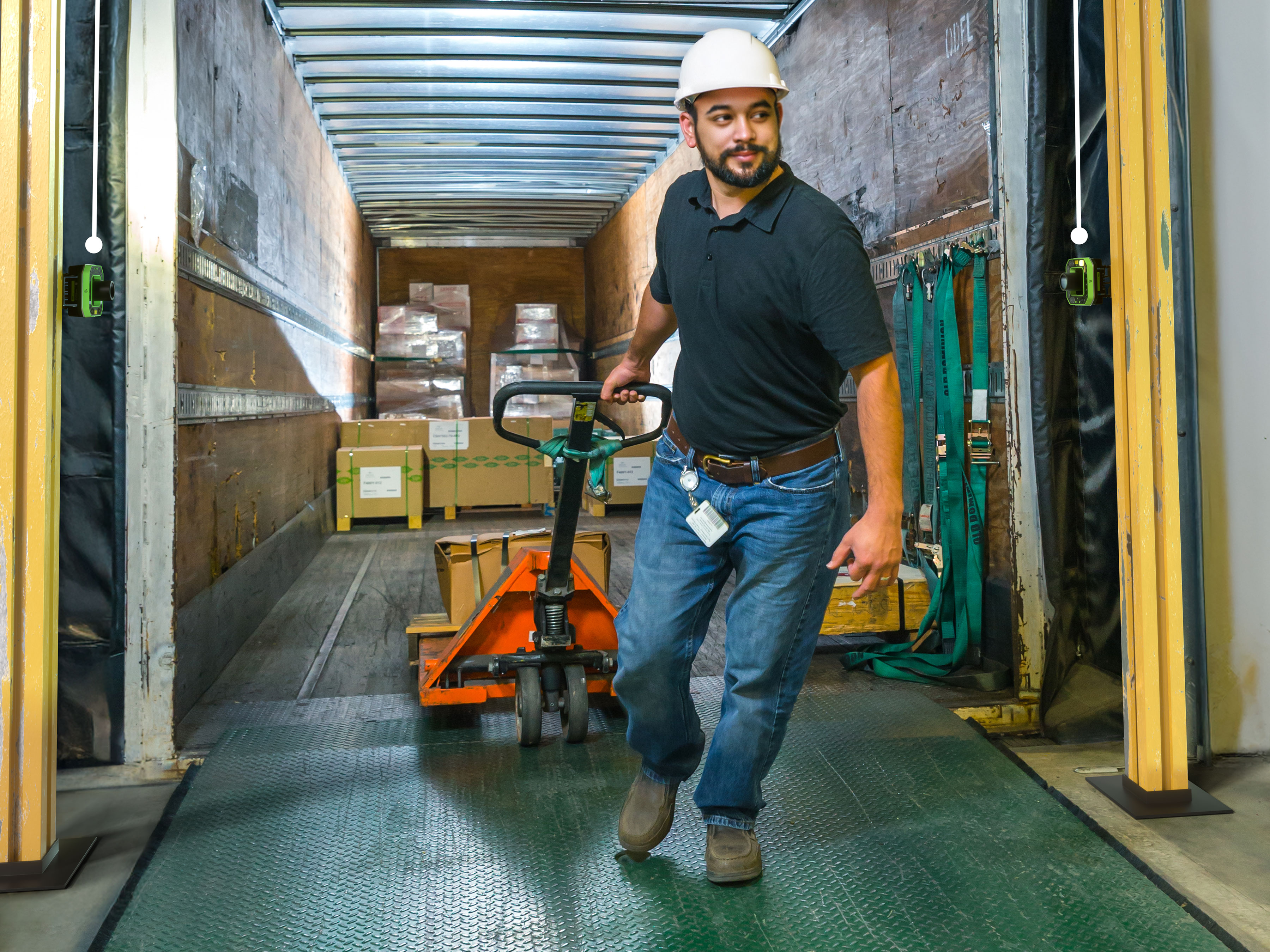 Dock worker with Zebra FS80 in a warehouse going through a dock door.