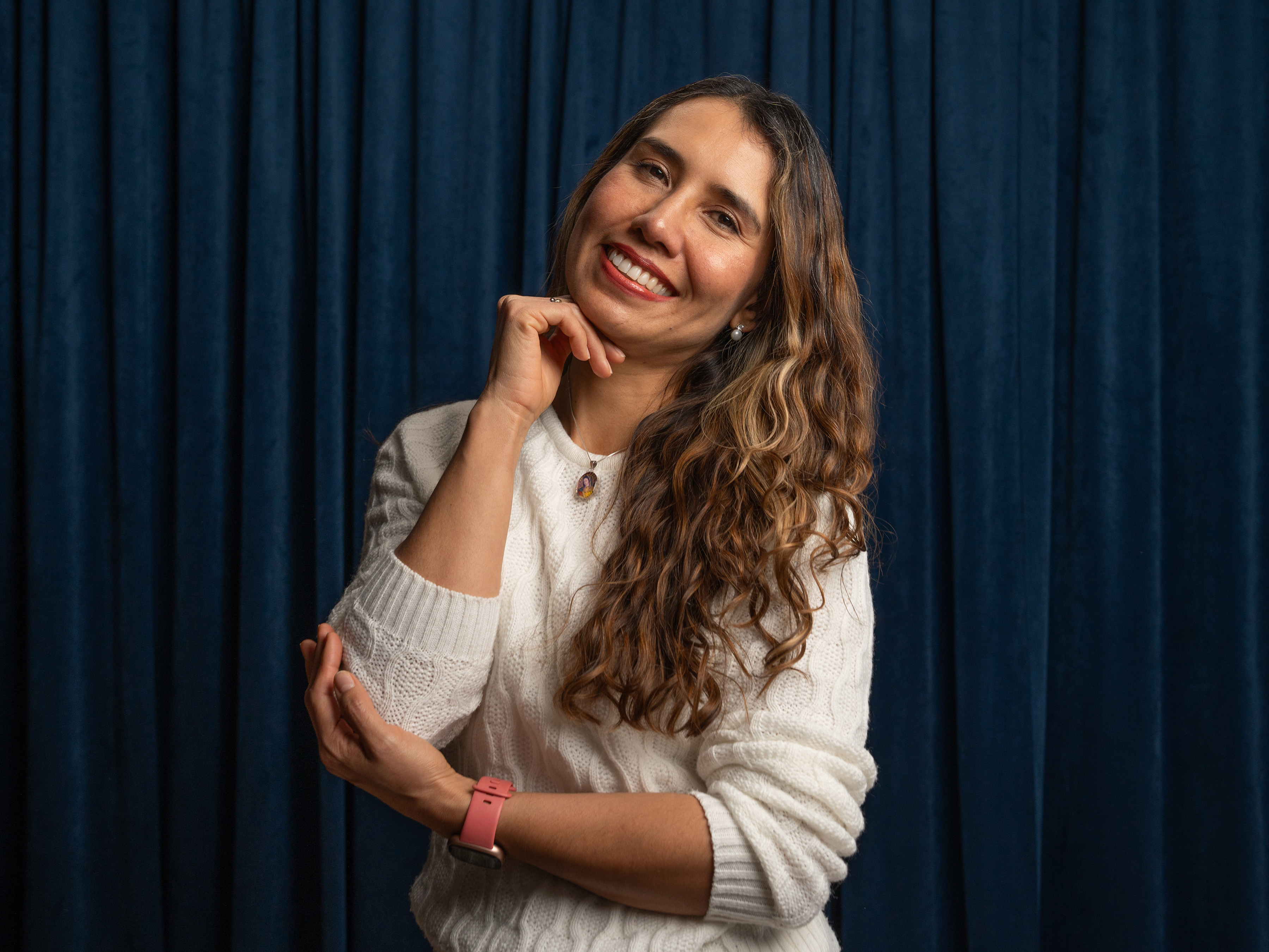 Sandra Mendez Zebra headshot on blue background