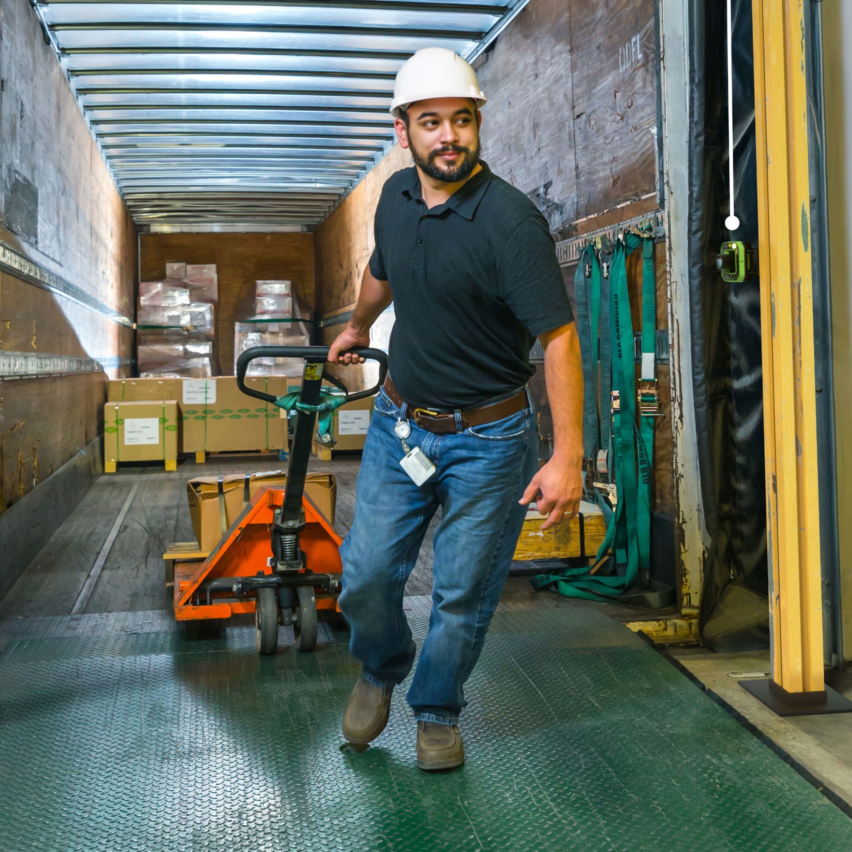 Dock worker with Zebra FS80 in a warehouse going through a dock door.