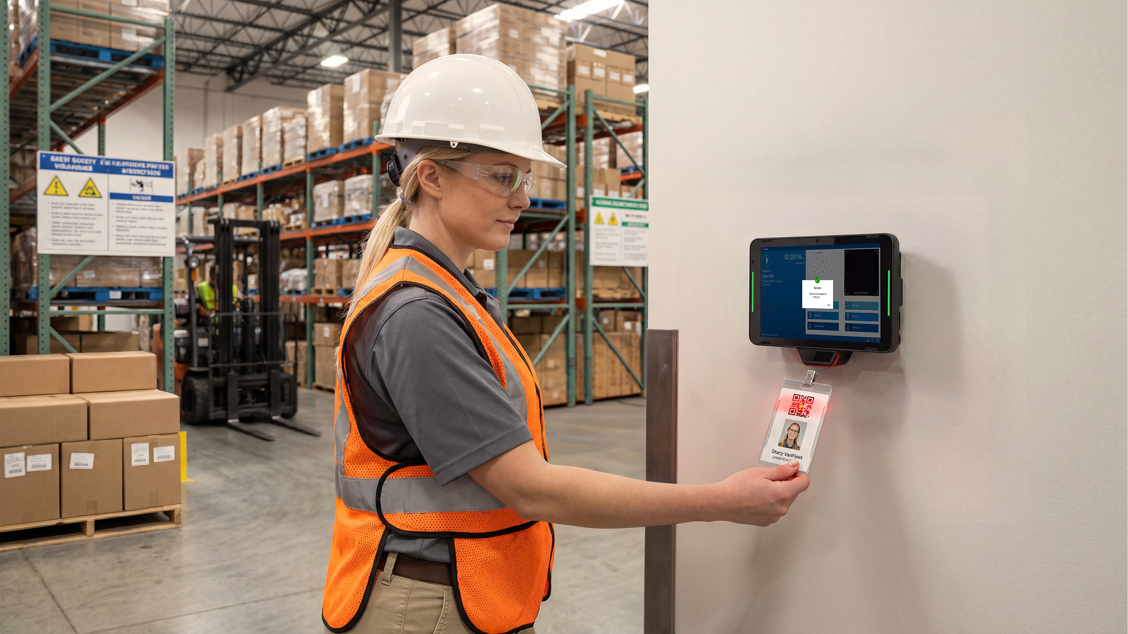 KC401 Interactive Kiosk with Workcloud Timekeeping software in a warehouse being used for employee clock badge-in scanning.