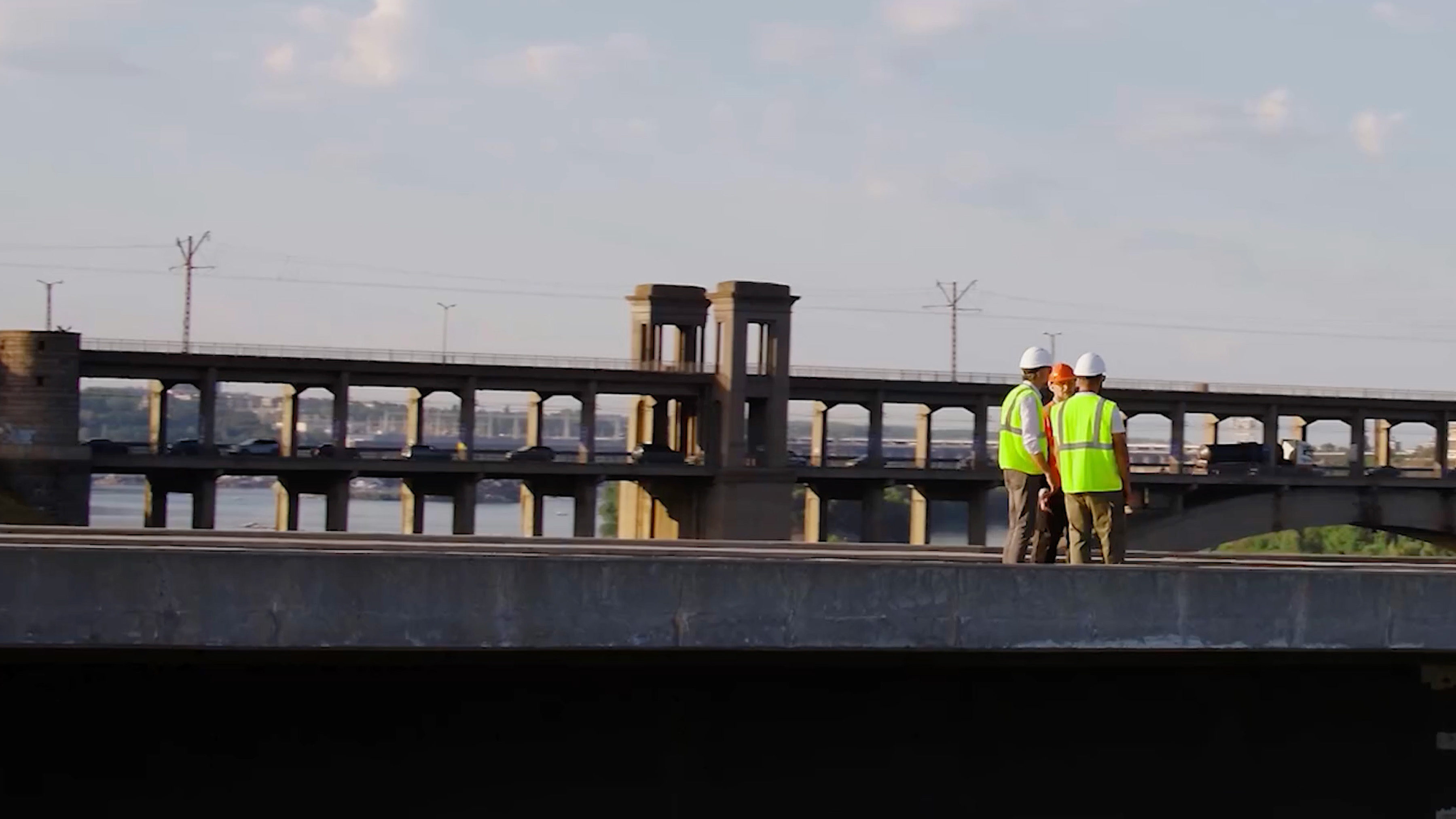 Industrial workers gathered on a levee.