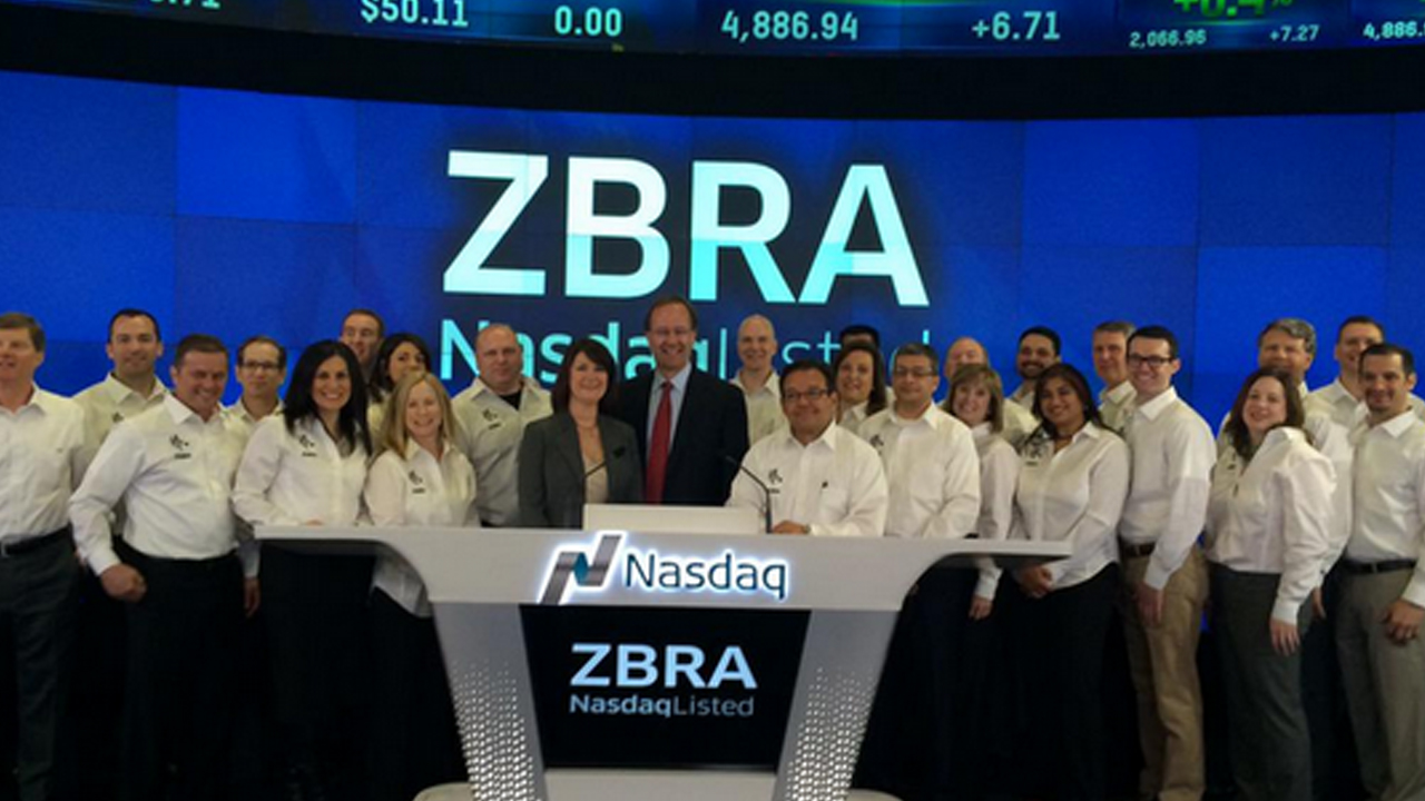 Zebra employees gather before the Nasdaq opening bell ceremony on April 16, 2015, during which time Zebra's new logo (the one still used today) was revealed.