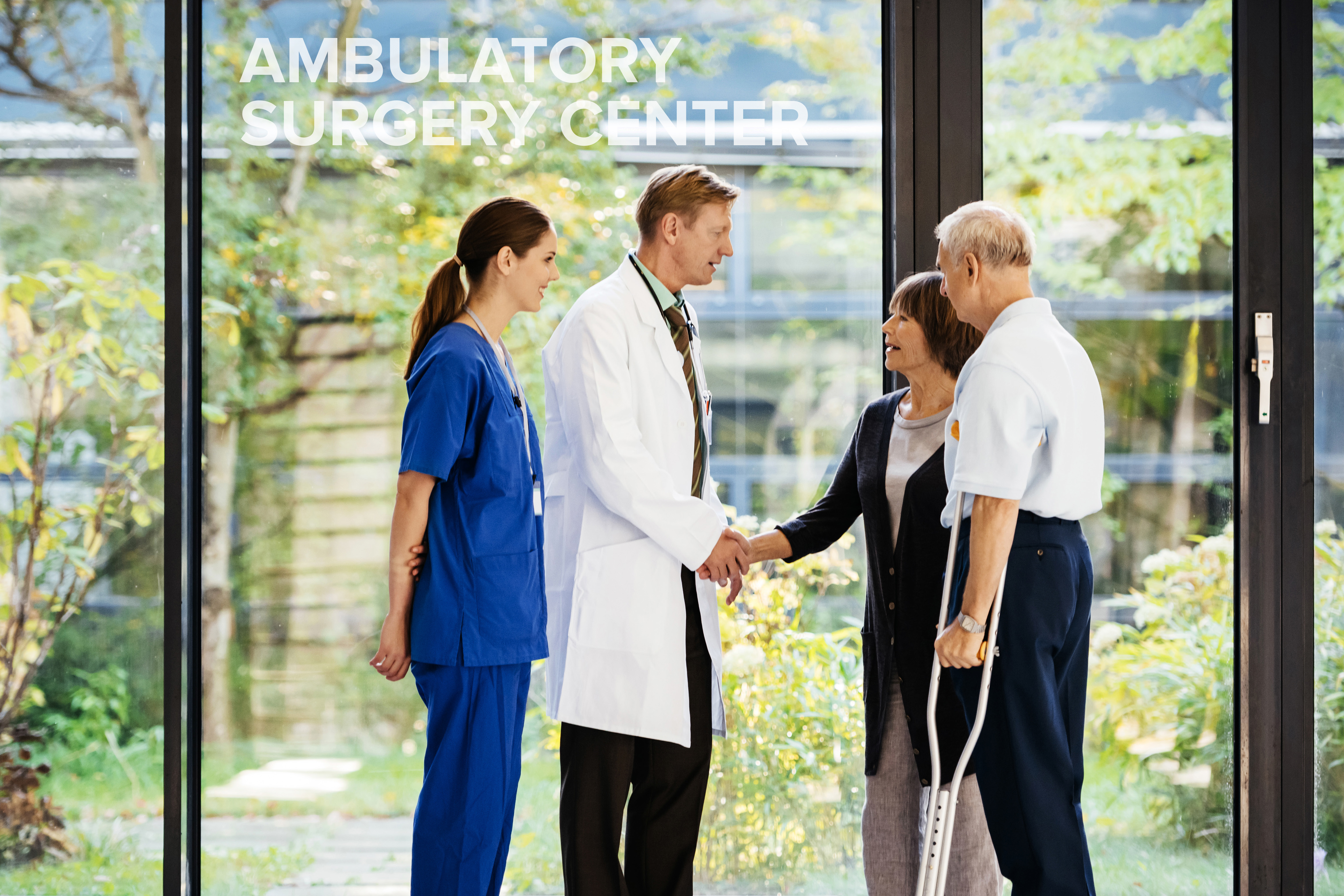 A doctor and nurse speak with patients int he lobby of an ambulatory surgery center.