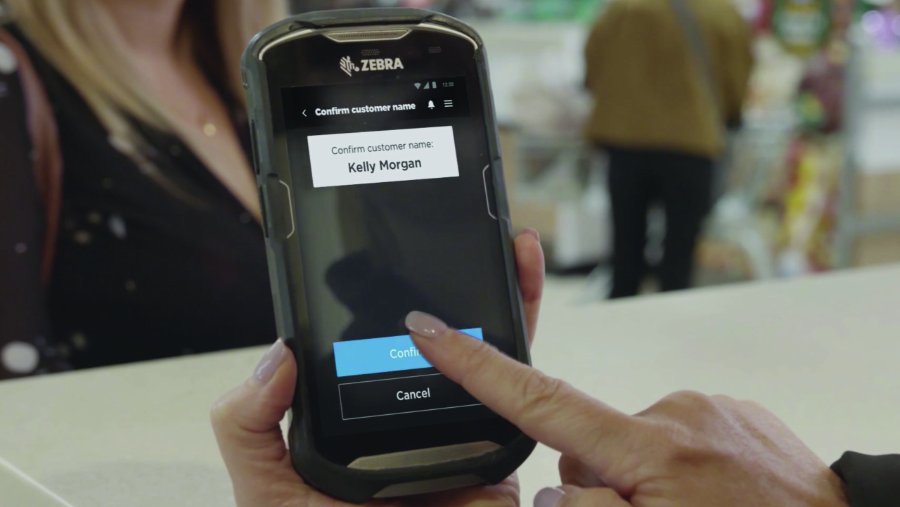 A Zebra touch screen mobile computer is used to initiate a shopper's online return in a retail store