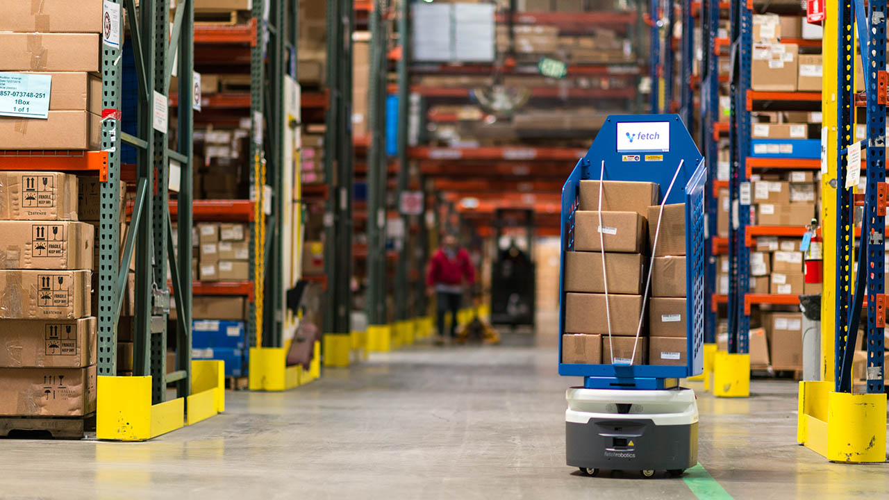 A Fetch AMR transports boxes across a warehouse