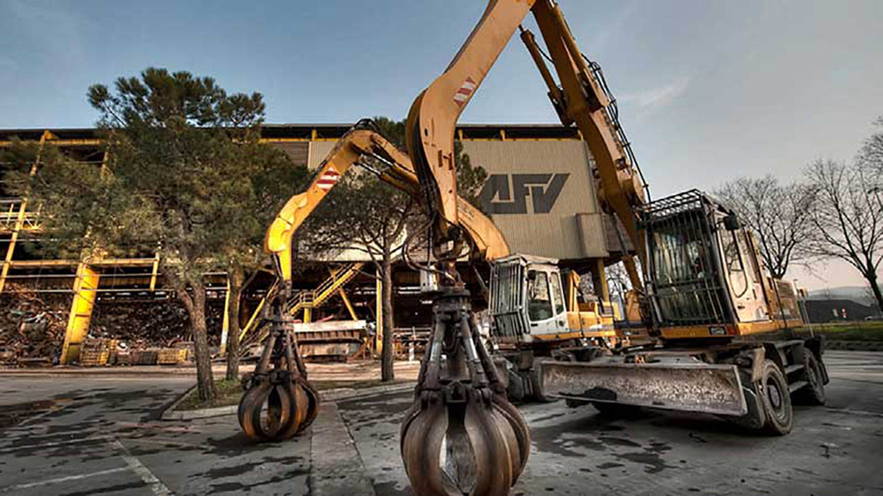 A heavy machine sits in front of the AFV headquarters building