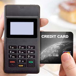 Zebra PD40 mobile payment device, shown swiping a credit card